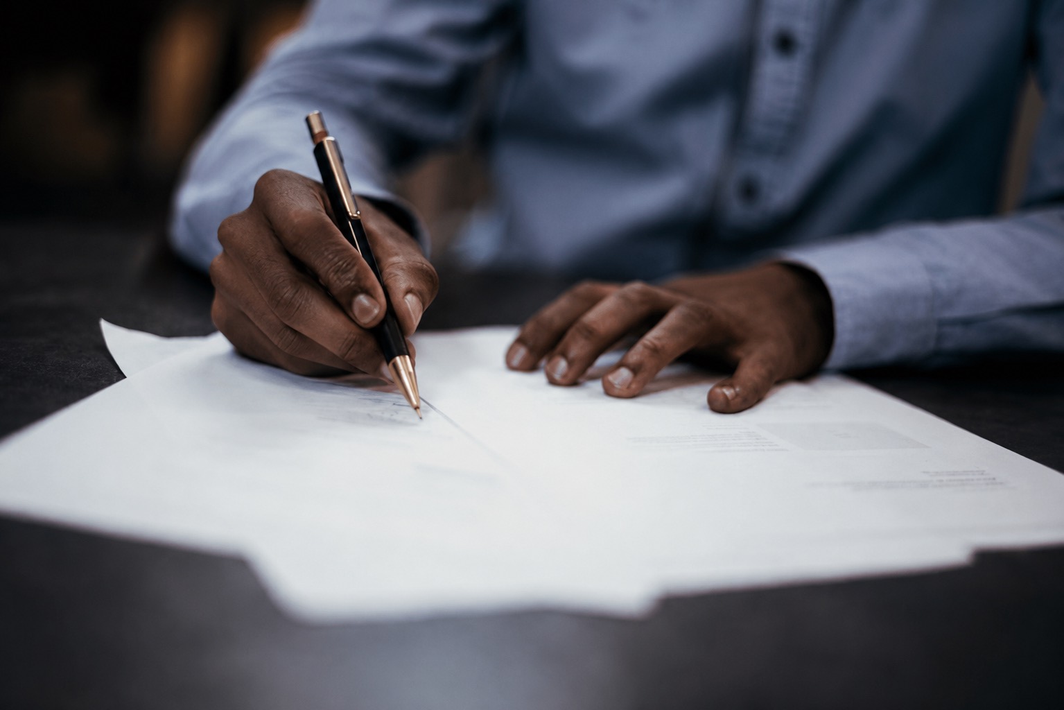 Counsel reviewing and signing an agreement